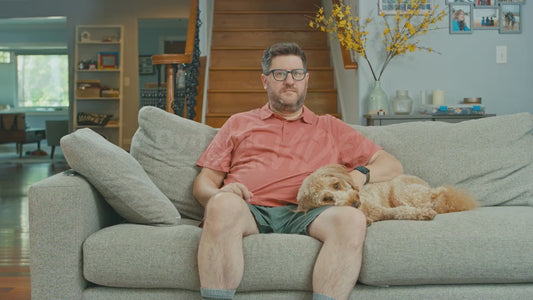 Man on Couch Thinking About Raisins While His Dog Rests
