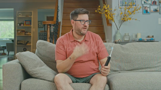 Man on Couch Inviting His Toothbrush to a Fun Costume Party