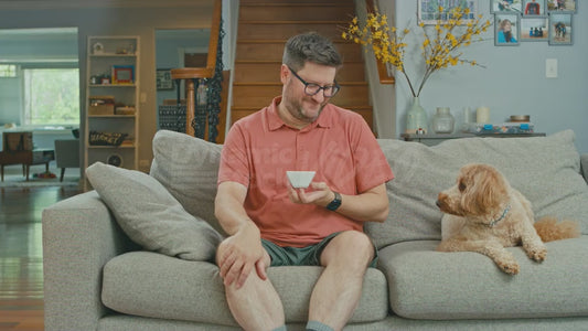 Man on Couch Holds a Ramekin of Mayonnaise But He Hates Mayonnaise