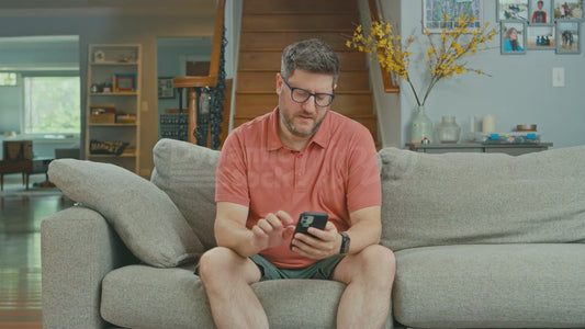 Man on Couch is Angry About His Phone's Limited Local Storage