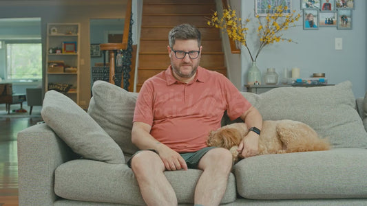 Man on Couch Holding Breath Painfully