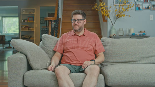 Man on Couch Tries to Plug Himself Into a USB Charger