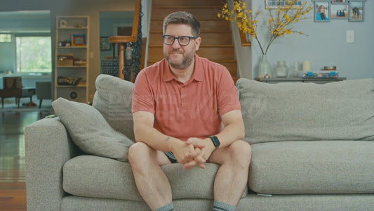 Man Enjoying Couch on a Tuesday When His Dog Wanders In