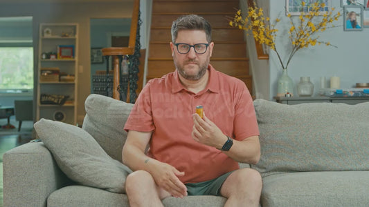 Man on Couch Karate Chopping a 9-Volt Battery