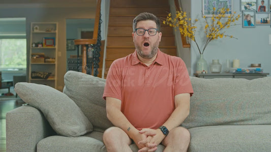 Man on Couch with Puffy Chubby Cheeks