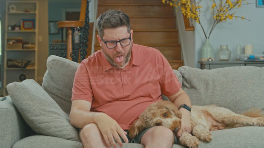 Man on Couch with Heavy Tongue