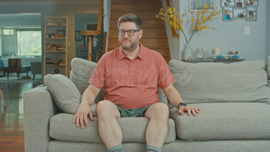 Man Feigning Enjoyment of Sitting on Couch